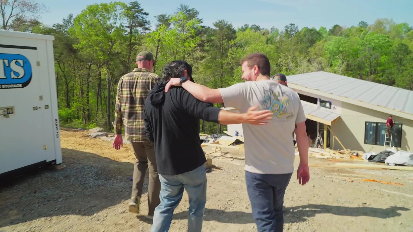 The Sweet Homes crew walking the build site